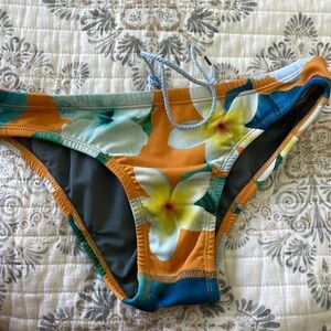 Jolyn “andy” bikini bottom, yellow print with hibiscus flowers, front tie